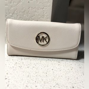 Cream colored MK wallet.